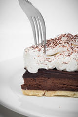 Chocolate tart with fork in white background