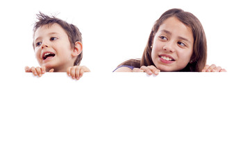 Kids holding a white board for text or image, isolated on white