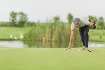 Young man playing golf