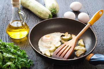 fried eggs with zucchini and parsley
