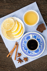 espresso in blue cup with lemon and honey on table