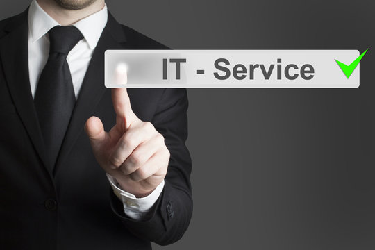 businessman pushing button it service checked