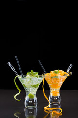 Orange and lime Mojito over black  background