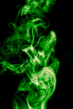 green smoke on black background