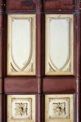 close up old wooden church door in italy