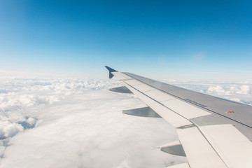 Obraz na płótnie Canvas Airplane wing out of window