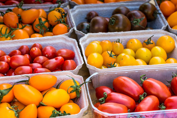 small tomatoes on display at the farmers market