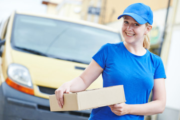 delivery woman with package outdoors