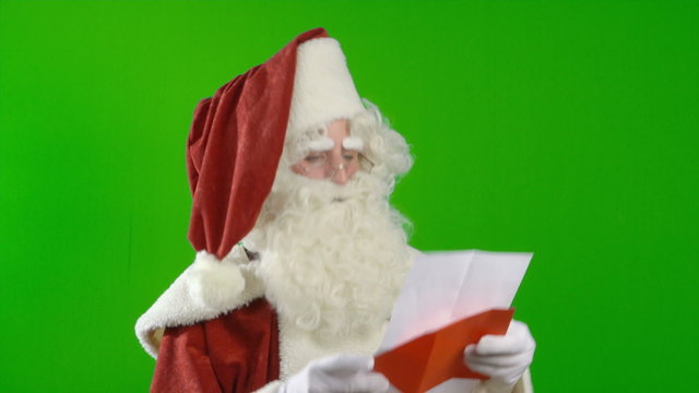 Santa Claus is Reading a Wish List and is Satisfied