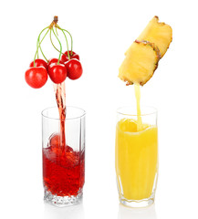 Juice pouring from fruits into glass, isolated on white