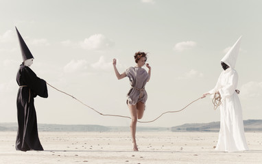 Woman hoping over the rope held by two mysterious persons - obrazy, fototapety, plakaty