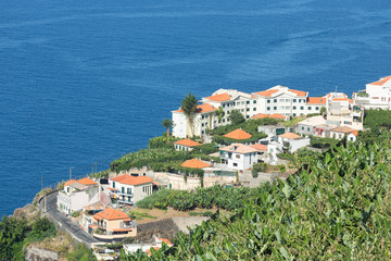 Obraz premium Aerial view of houses along coastline Madeira Island