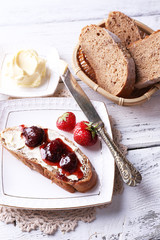 Fresh toast with homemade butter and strawberry jam