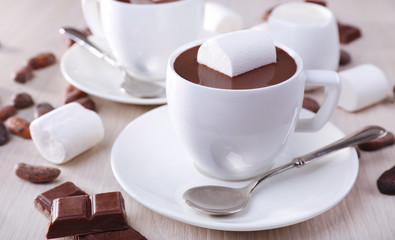 Cups of hot chocolate on table, close up