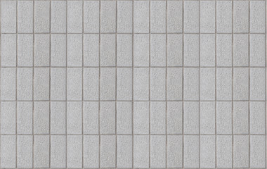 A grey tile wall