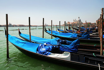 Fototapeta na wymiar Gondolas moored by Saint Mark square. Venice, Italy, Europe