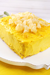 Tasty lemon cake on wooden table