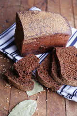 Fresh baked bread on wooden background