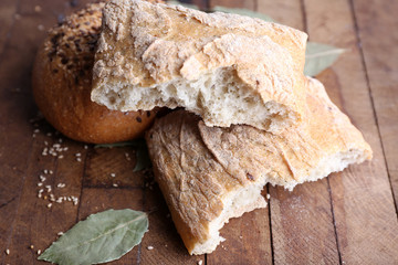 Fresh baked bread, on wooden background