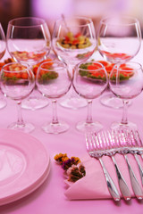 Buffet table with dishware waiting for guests