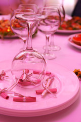 Buffet table with dishware waiting for guests