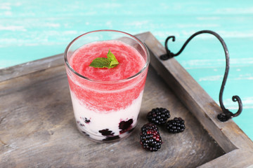 Watermelon cocktail in glass on wooden table