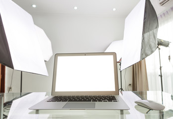 laptop in studio with softbox