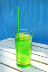 Refreshing cocktail on table, outdoors