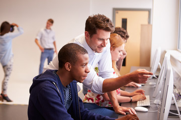 College Students Using Computers On Media Studies Course