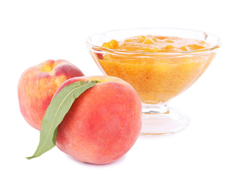 tasty peach jam with fresh peaches, isolated on white