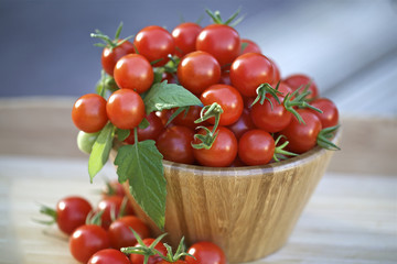 Cherry tomatoes in a wooden bowl