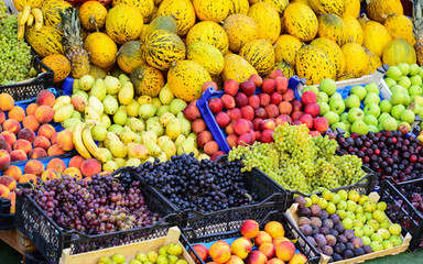 Market with various colorful fresh fruits and vegetables