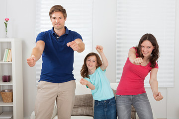Happy Family Playing Videogame © Andrey Popov