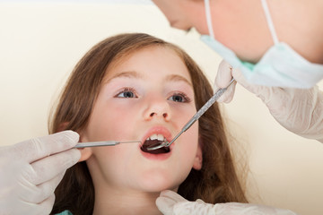 Girl Going Through Dental Examination