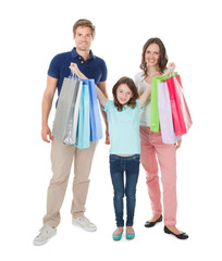 Fototapeta premium Portrait Of Happy Family With Shopping Bags