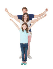 Happy Family With Arms Raised Standing In Line