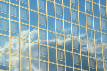 Reflection of clouds at building windows