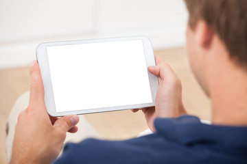 Man Using Digital Tablet At Home