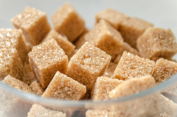 Brown sugar cubes in a glass