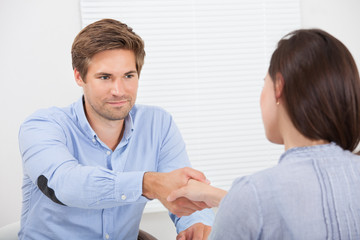 Smiling Candidate Shaking Hand With Businessman