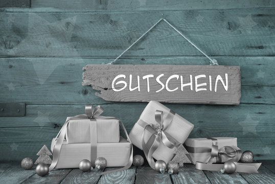 Weihnachtsgutschein in silber und mintgr&uuml;n auf Holz