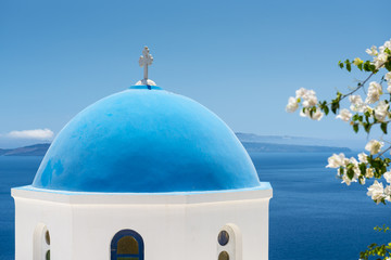 Fototapeta na wymiar Church With Blue Cupola in Santorini, Greece