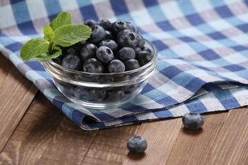 Fresh blueberries in a glass bowl