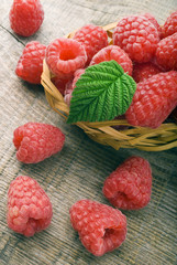 Heap of raspberry on a wooden background