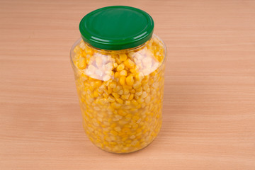 yellow corn in glass jar