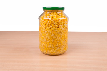 yellow corn in glass jar