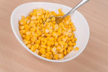 yellow corn in a bowl on the table