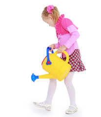 cheerful girl watering the garden