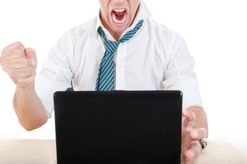 anonymous businessman smashing his laptop on table with fist