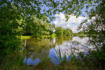 Fototapeta na wymiar lake in the nature and blue sky